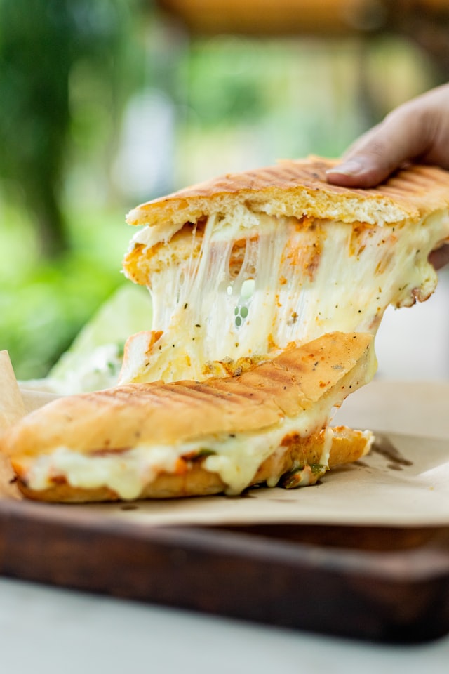 How do you use a hand held grater?
